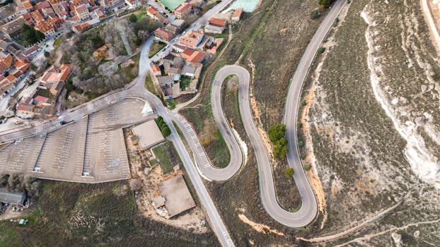 Aerial photograph showcasing winding roads and architecture in Peñafiel, Spain.